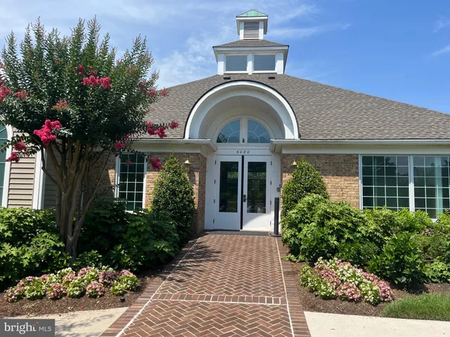 a backyard of a house with yard and outdoor seating