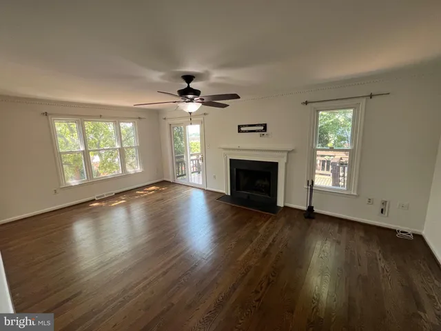 a view of balcony with wooden floor and fence