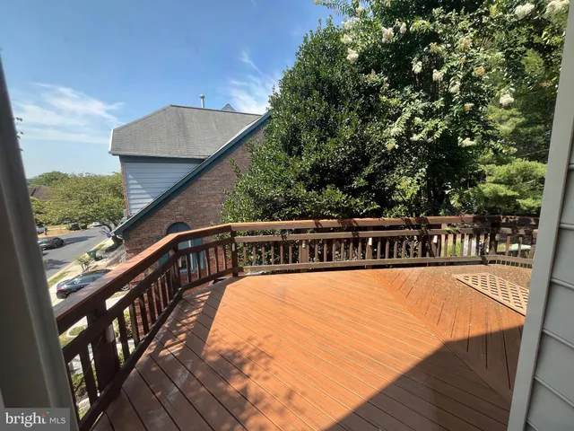 a large kitchen with a large window a sink and stainless steel appliances