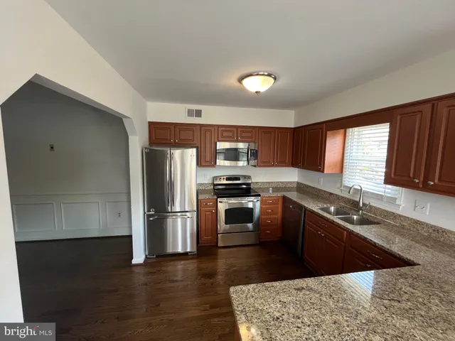 a view of entryway with wooden floor