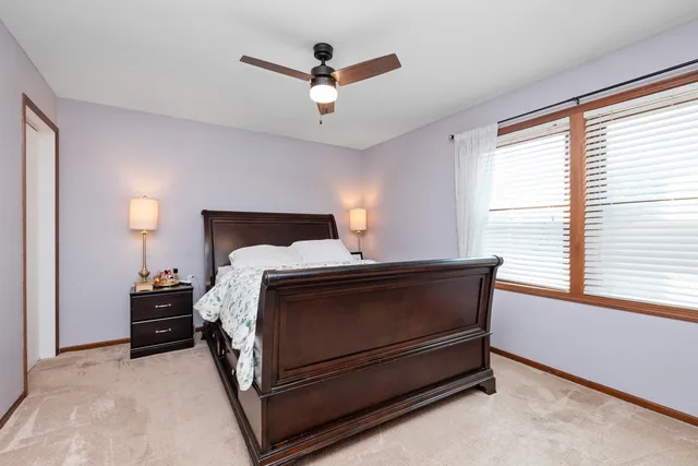 a bed room with a bed and a window