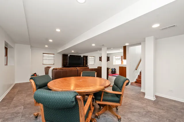 a outdoor dining space with furniture and a kitchen