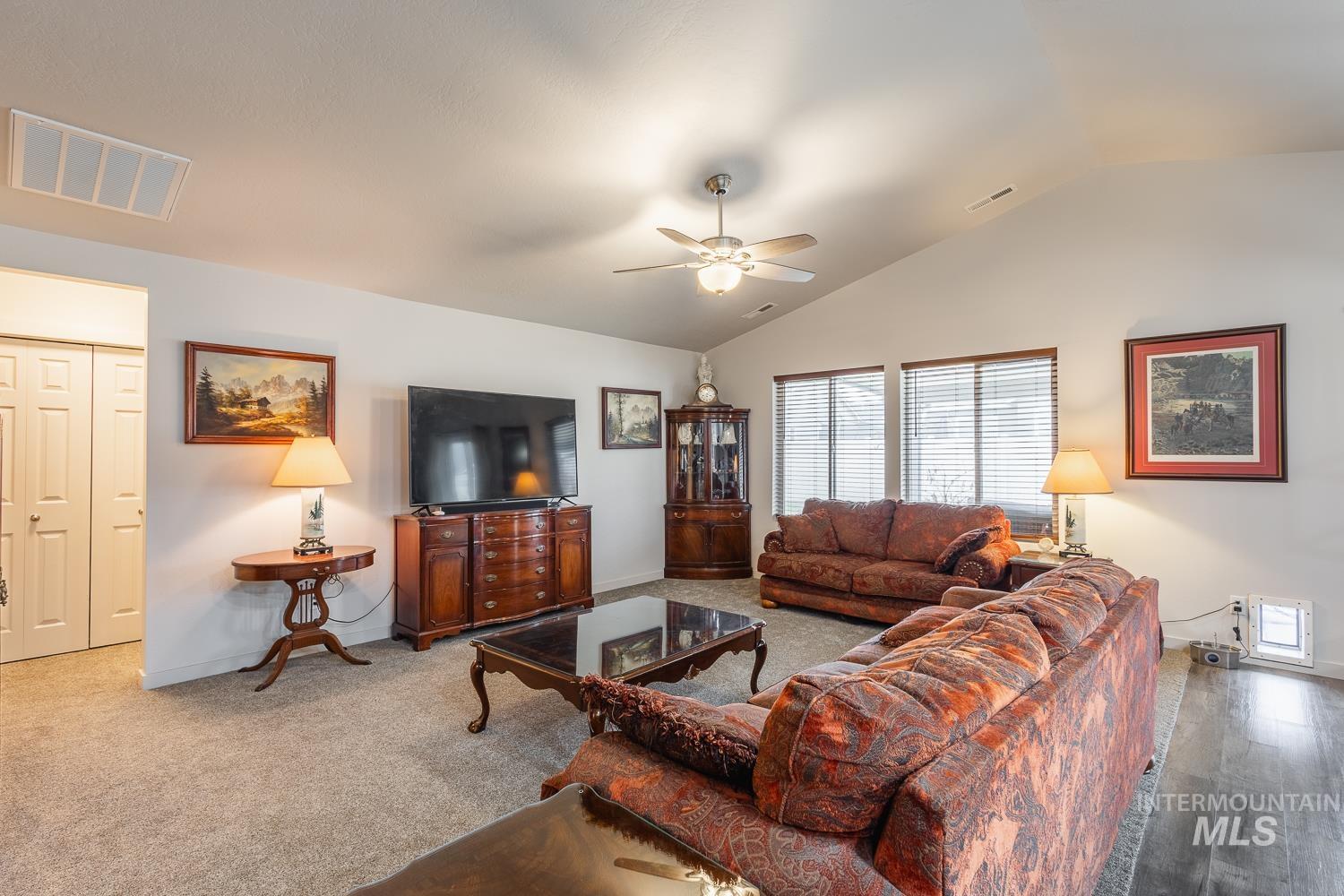 11309 West Viola Street Nampa, ID 83651 - Photo 11 of 37 Living area with lofted ceiling and a ceiling fan