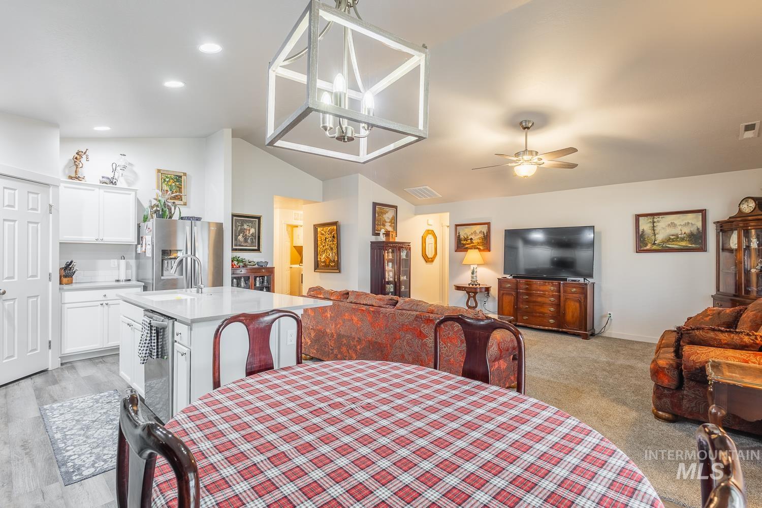 11309 West Viola Street Nampa, ID 83651 - Photo 20 of 37 Dining room featuring vaulted ceiling, ceiling fan, a chandelier, and recessed lighting