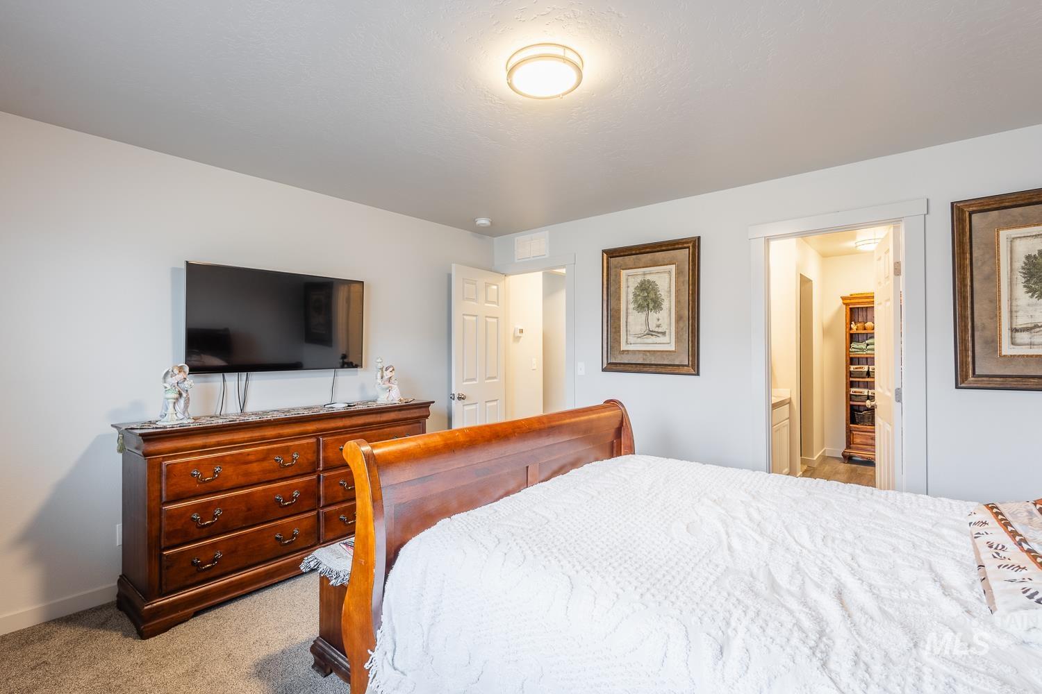 11309 West Viola Street Nampa, ID 83651 - Photo 22 of 37 Bedroom featuring light colored carpet and baseboards