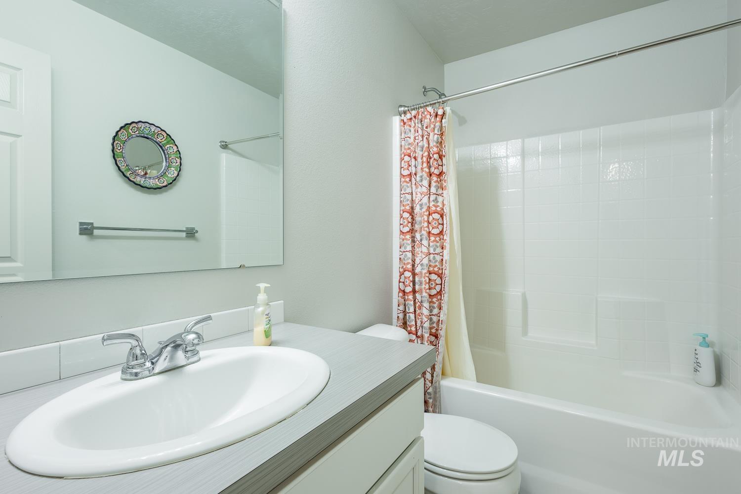 11309 West Viola Street Nampa, ID 83651 - Photo 30 of 37 Bathroom with shower / bath combo with shower curtain and vanity