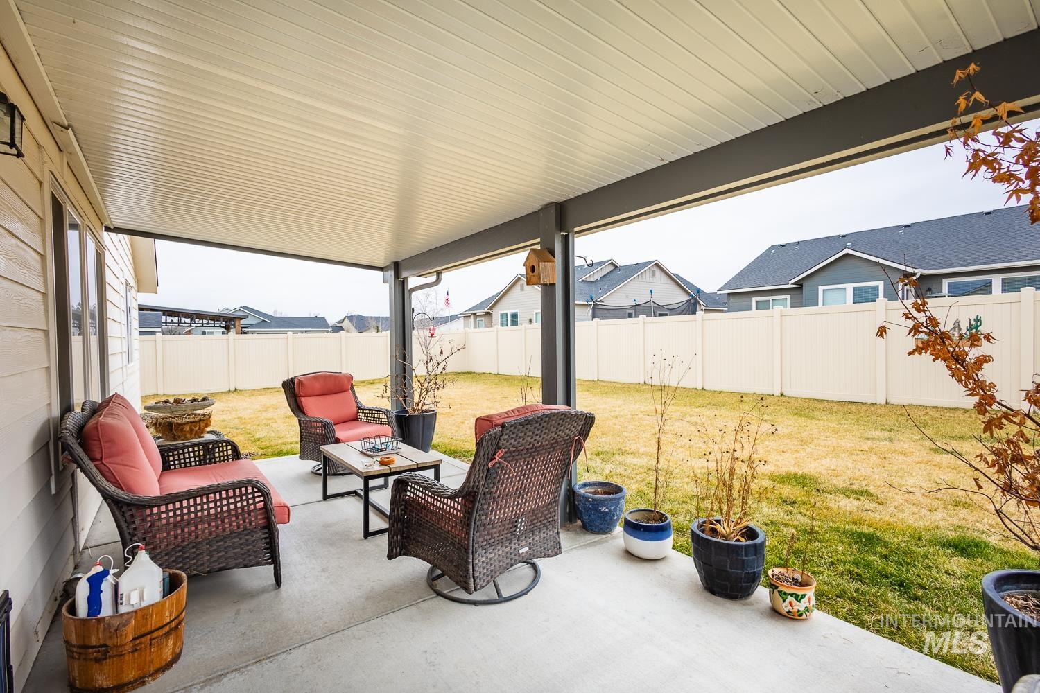 11309 West Viola Street Nampa, ID 83651 - Photo 33 of 37 Fenced backyard featuring an outdoor living space and a patio area