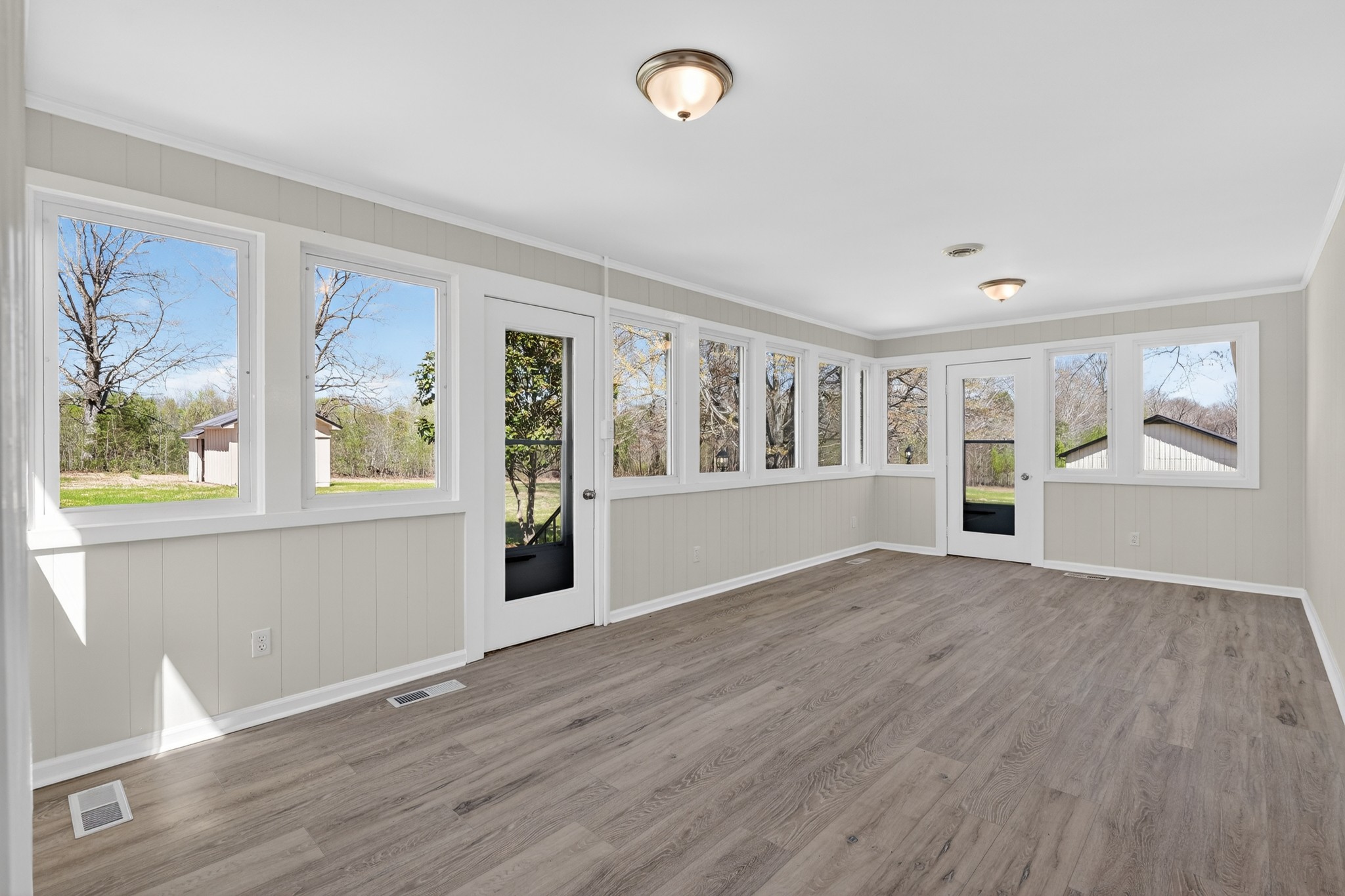 274 Howell Hill Road Kelso, TN 37348 - Photo 11 of 46 a view of an empty room with wooden floor and a window