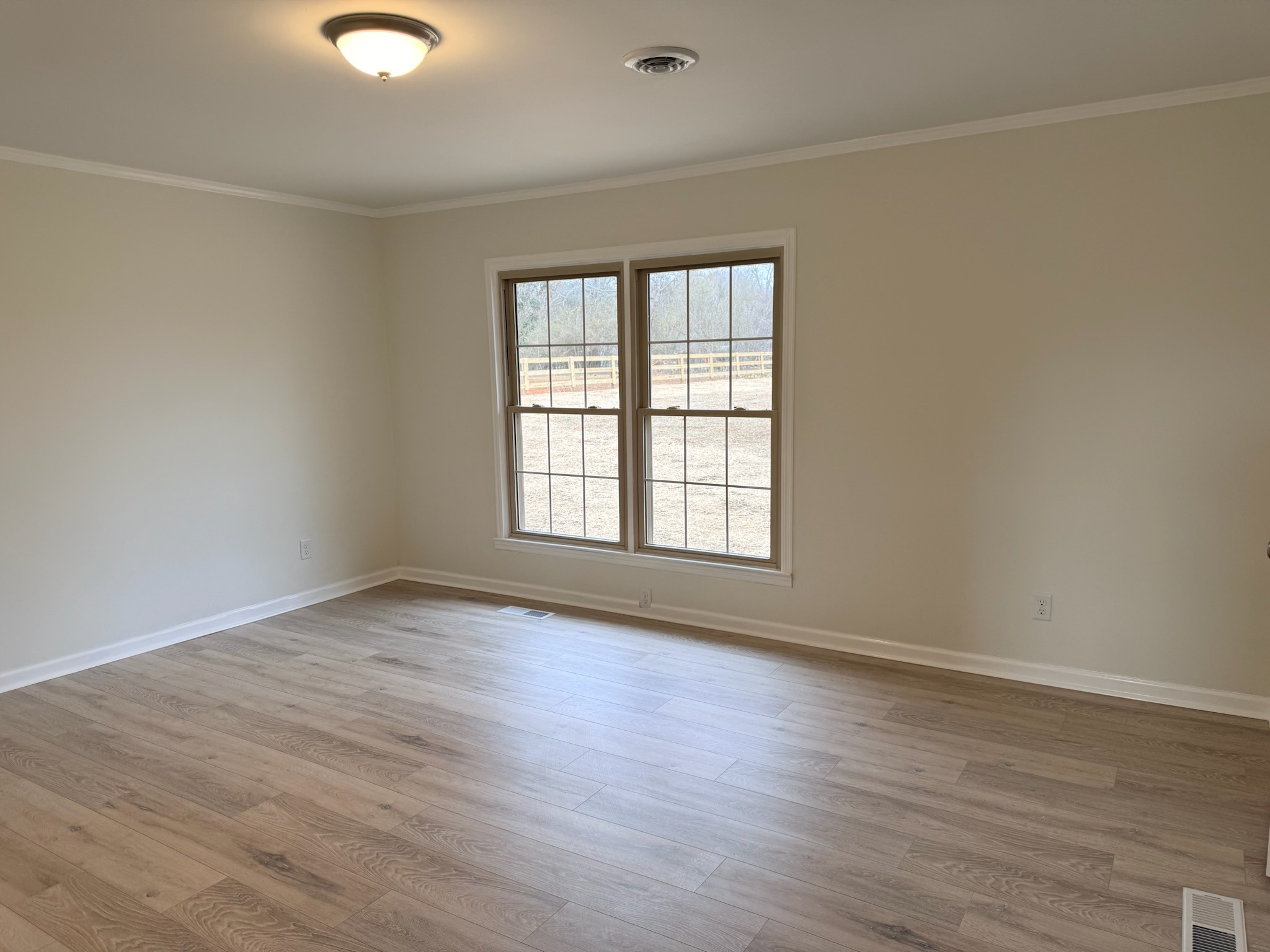 274 Howell Hill Road Kelso, TN 37348 - Photo 13 of 31 wooden floor in an empty room with a window