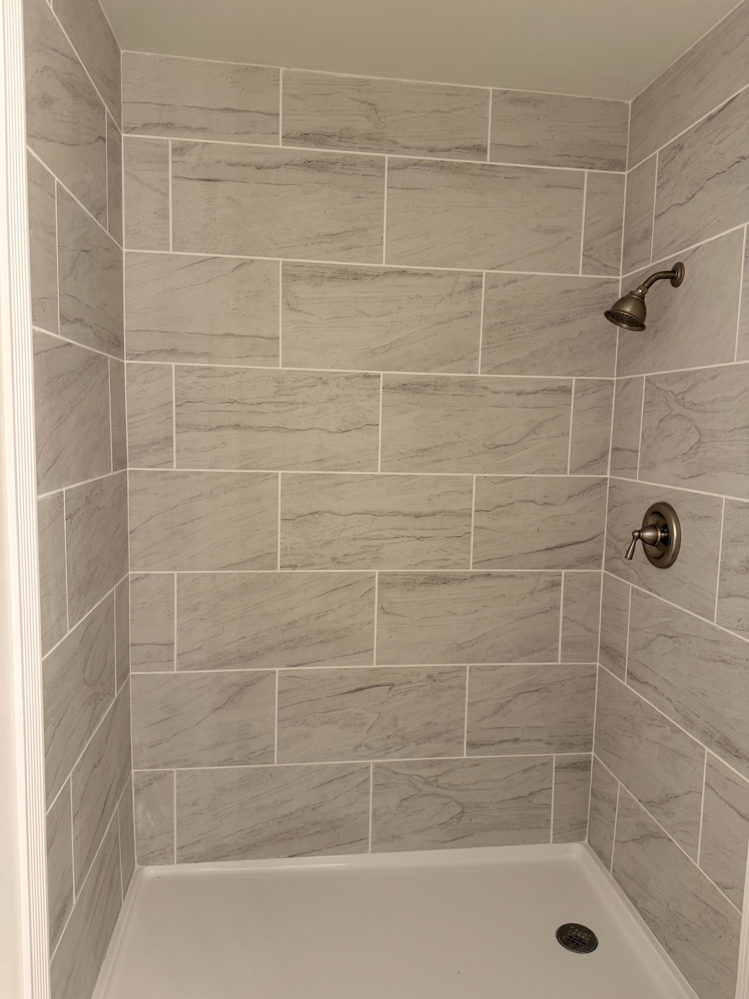 274 Howell Hill Road Kelso, TN 37348 - Photo 15 of 31 a bathroom with a shower and a bathtub