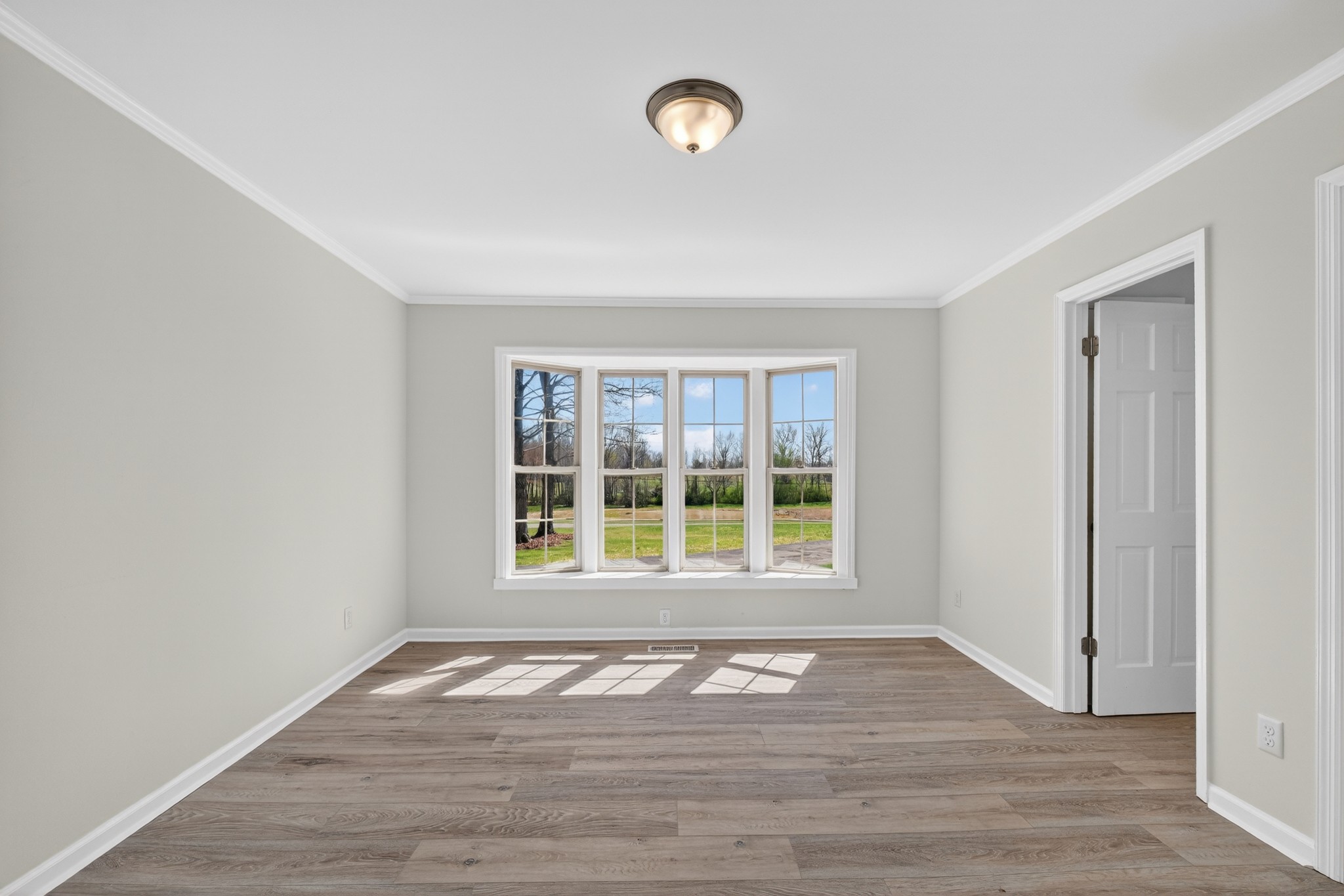 274 Howell Hill Road Kelso, TN 37348 - Photo 16 of 46 a view of empty room with wooden floor and fan