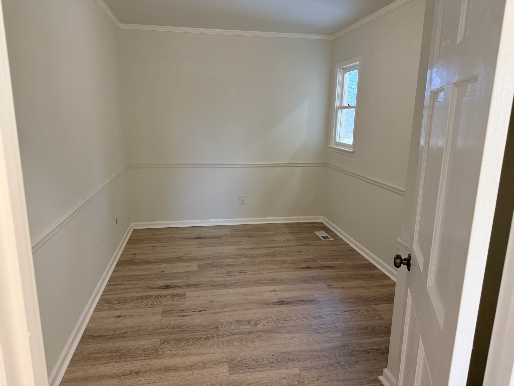 274 Howell Hill Road Kelso, TN 37348 - Photo 17 of 31 a view of a room with wooden floors and white walls