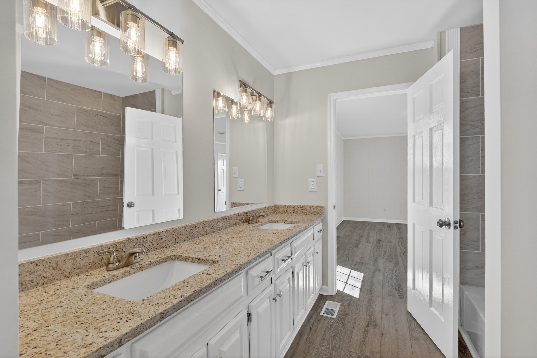274 Howell Hill Road Kelso, TN 37348 - Photo 18 of 46 a bathroom with a granite countertop double vanity sink and mirror
