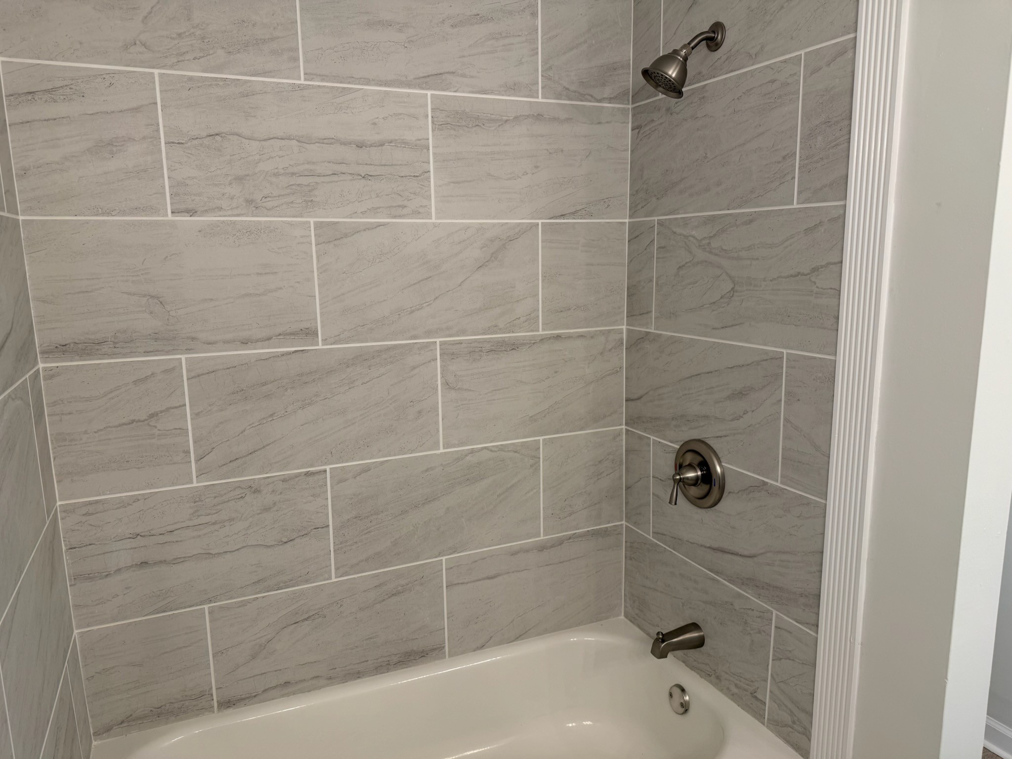 274 Howell Hill Road Kelso, TN 37348 - Photo 18 of 31 a bathroom with a shower and a bathtub