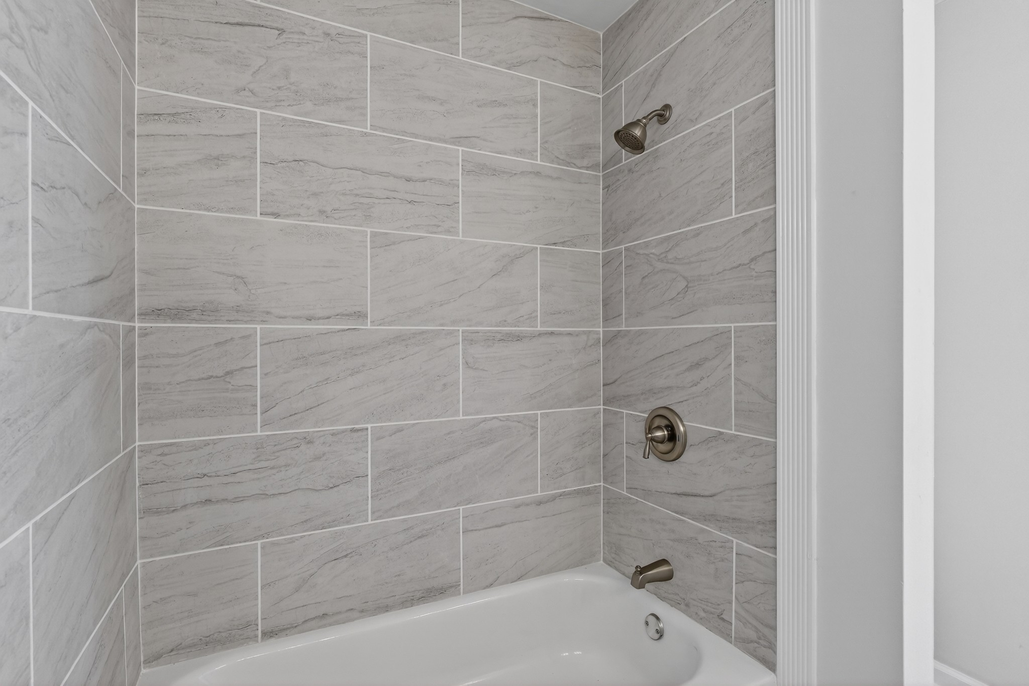 274 Howell Hill Road Kelso, TN 37348 - Photo 20 of 46 a bathroom with a bathtub and a shower