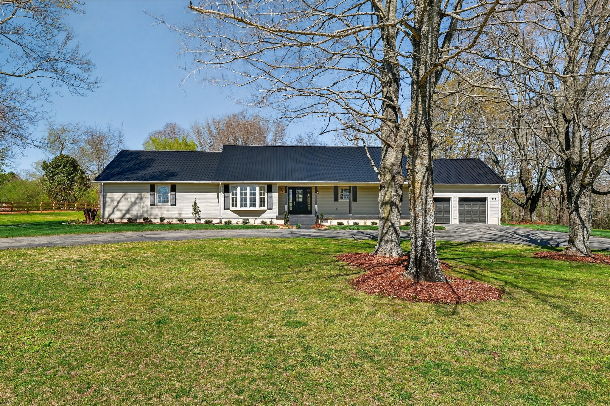 274 Howell Hill Road Kelso, TN 37348 - Photo 2 of 46 a front view of a house with garden