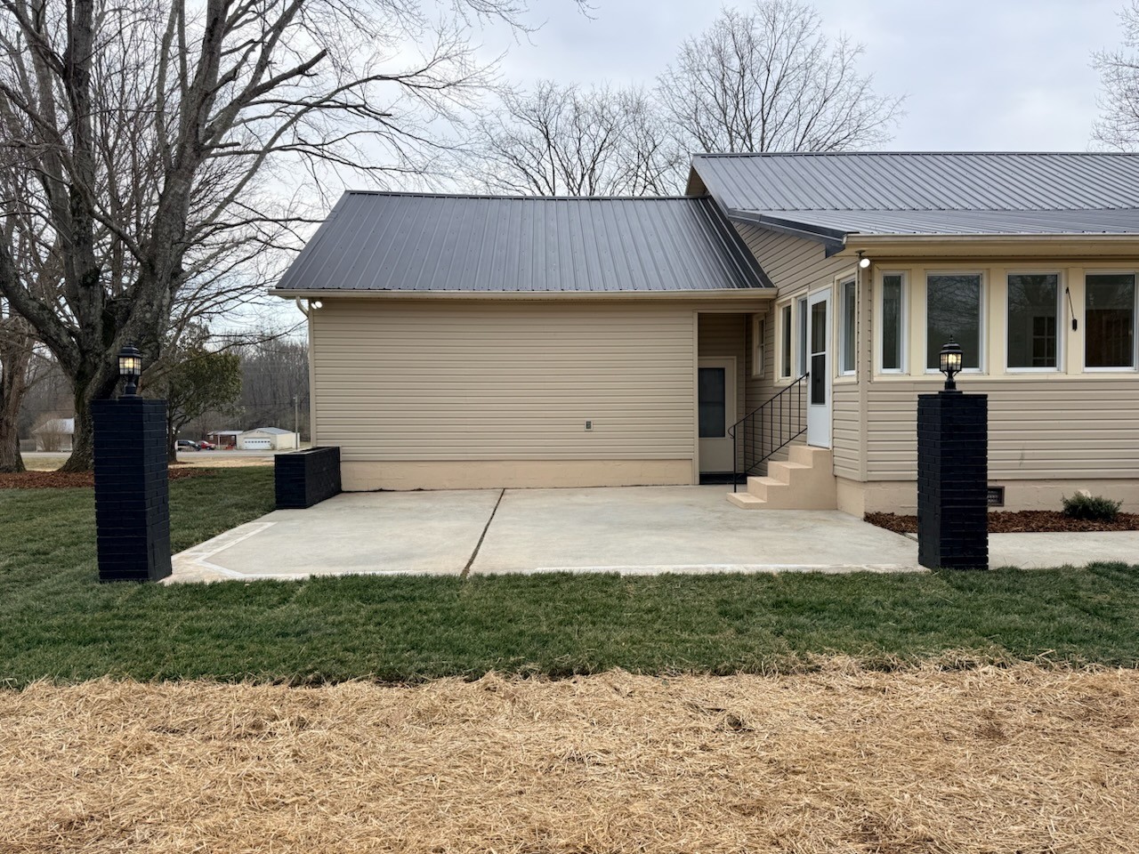 274 Howell Hill Road Kelso, TN 37348 - Photo 22 of 31 a front view of a house with a yard and a garage