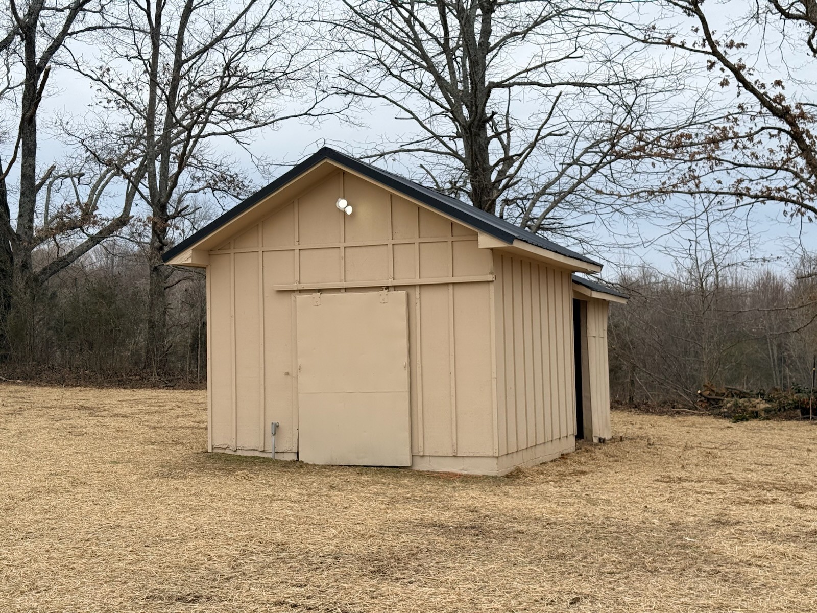 274 Howell Hill Road Kelso, TN 37348 - Photo 24 of 31 a view of wooden house with a yard and covered with snow