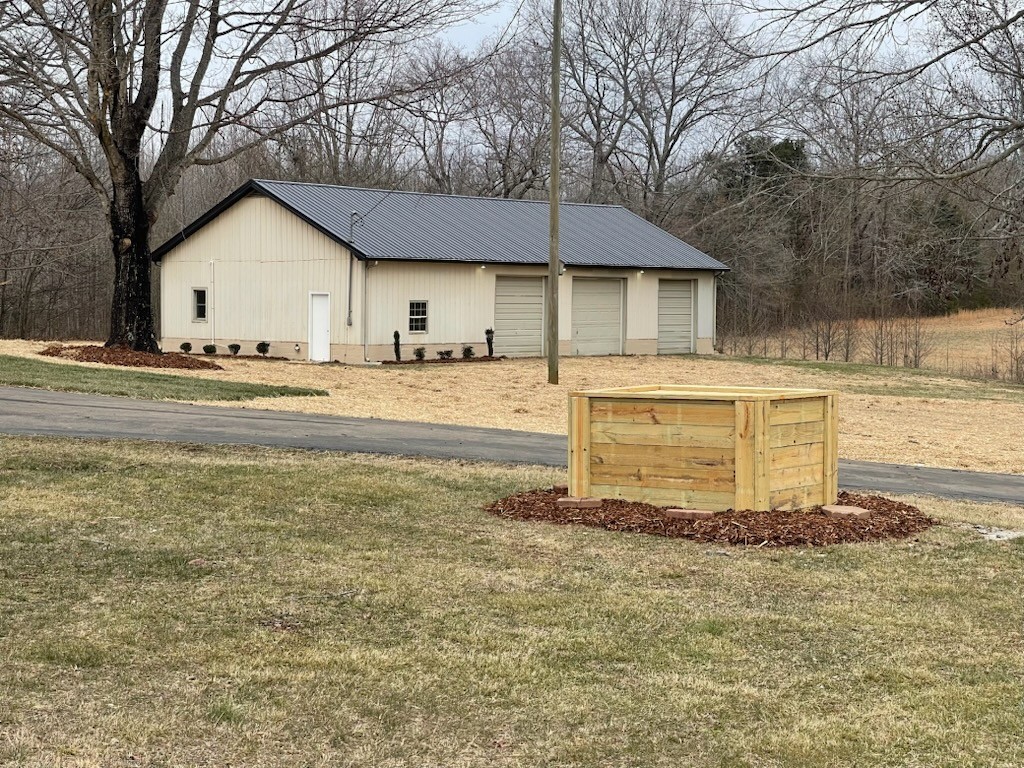 274 Howell Hill Road Kelso, TN 37348 - Photo 26 of 31 a house with trees in front of it
