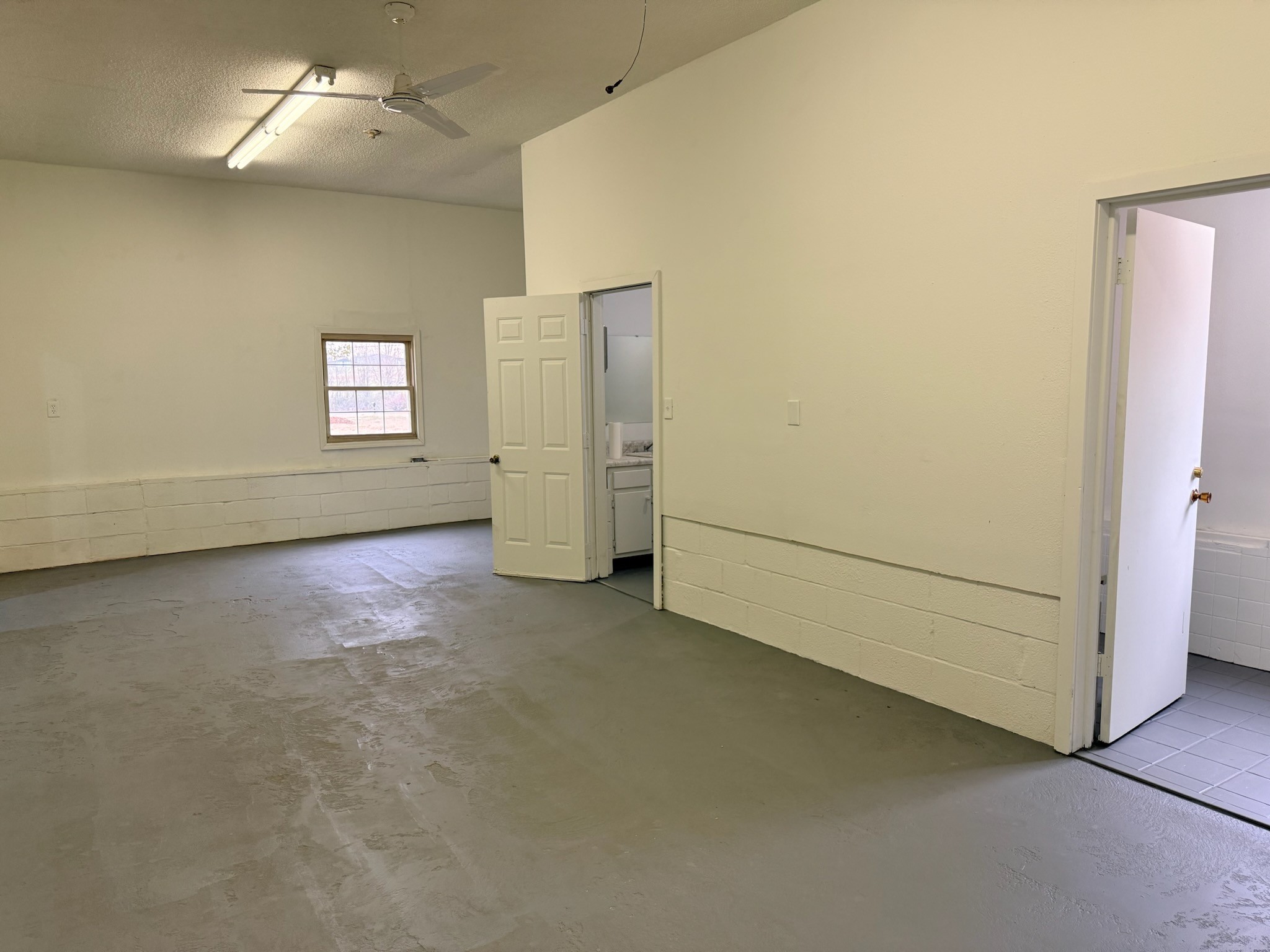 274 Howell Hill Road Kelso, TN 37348 - Photo 30 of 31 an empty room with a empty space and windows