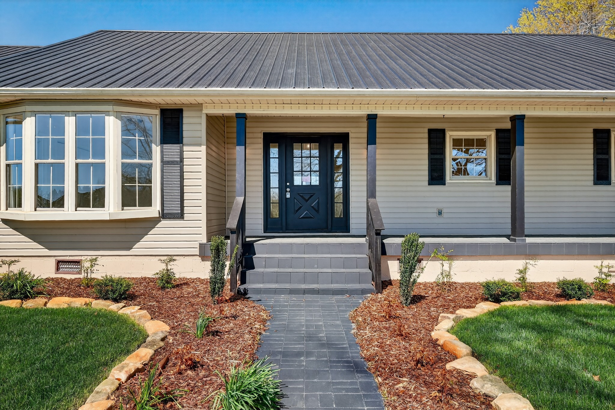 274 Howell Hill Road Kelso, TN 37348 - Photo 4 of 46 a front view of a house with a yard