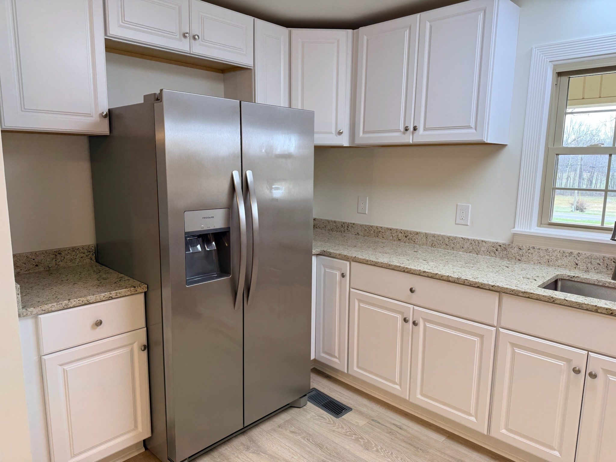 274 Howell Hill Road Kelso, TN 37348 - Photo 7 of 31 a kitchen with cabinets and a refrigerator
