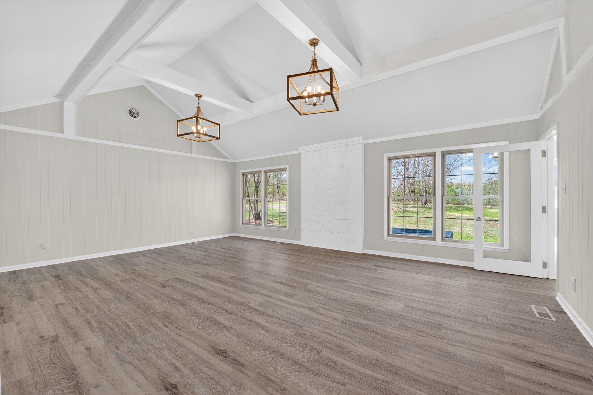 274 Howell Hill Road Kelso, TN 37348 - Photo 8 of 46 an empty room with wooden floor and windows