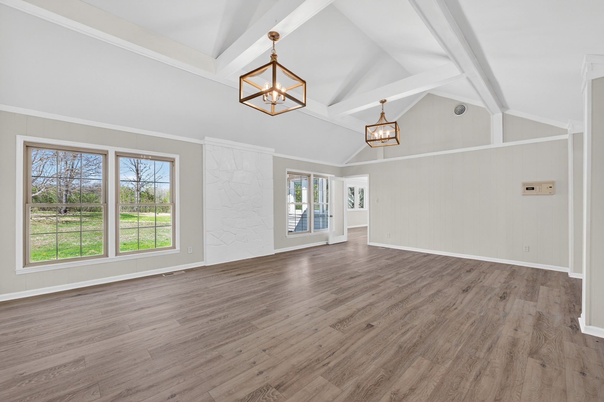 274 Howell Hill Road Kelso, TN 37348 - Photo 10 of 46 a view of an empty room with wooden floor and a window