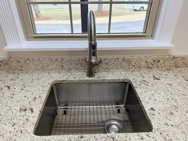 a bathroom with a sink and vanity