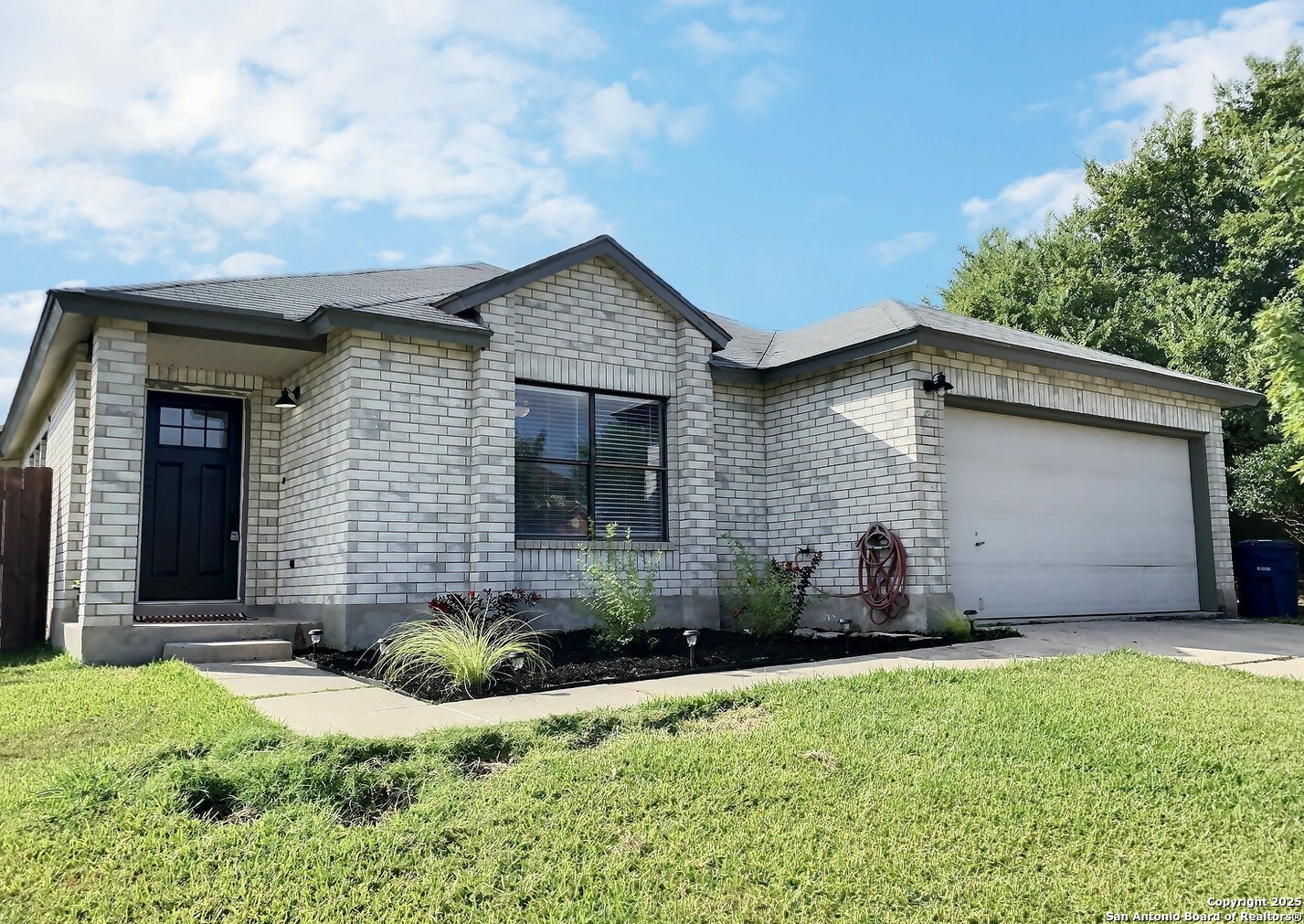 a front view of a house with a yard