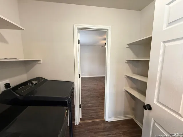 a kitchen with a refrigerator and a stove