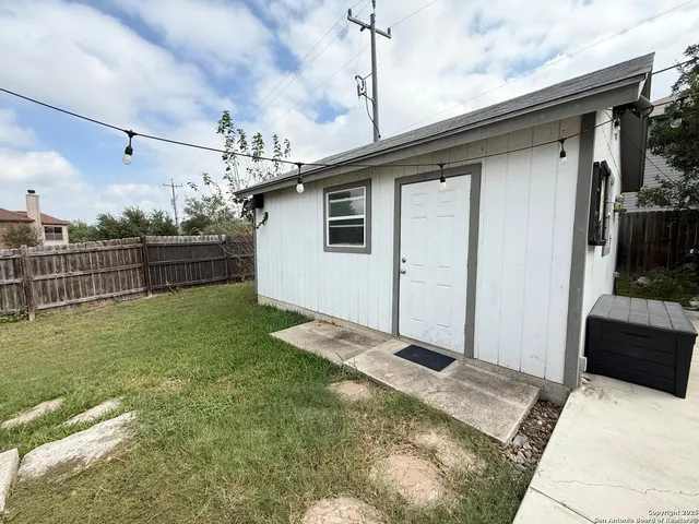 a backyard of a house with lots of green space