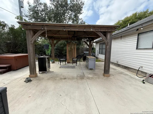 a view of patio with chairs and a table