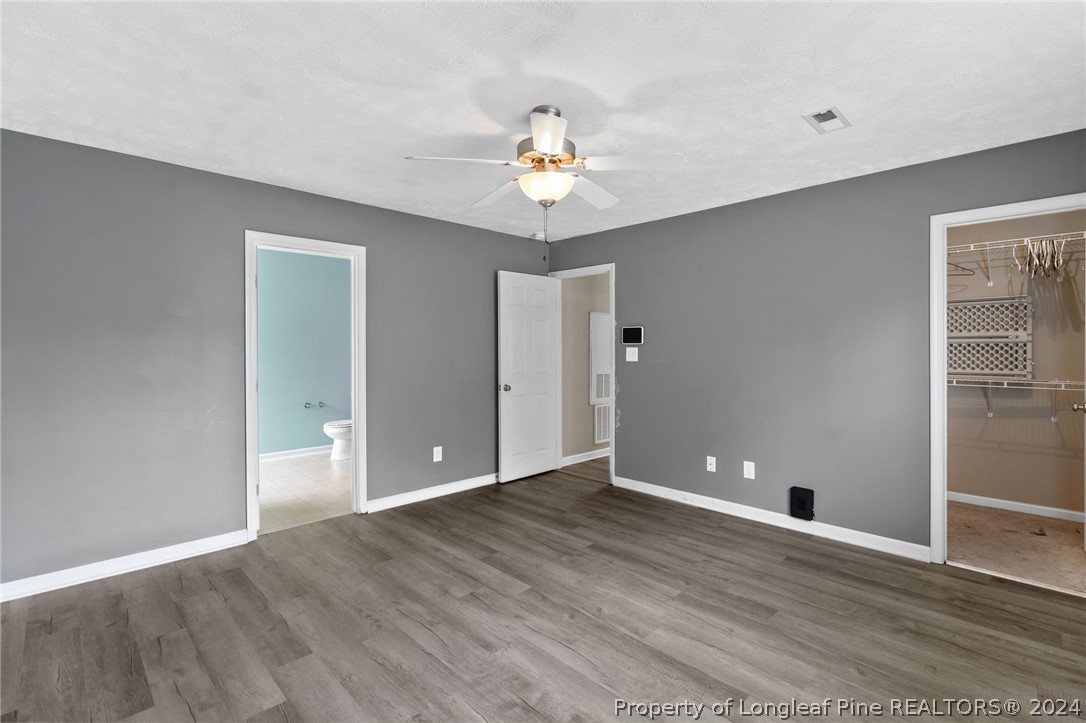 519 Cape Fear Road Raeford, NC 28376 - Photo 13 of 39 a view of an empty room with window and wooden floor