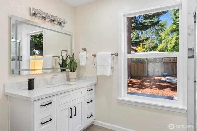 a bathroom with a sink and a mirror