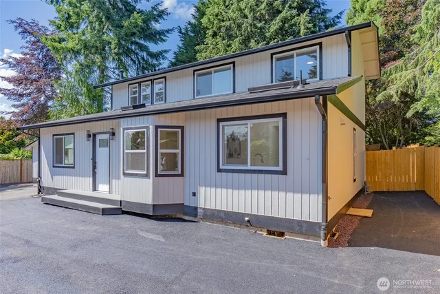 a front view of a house with yard