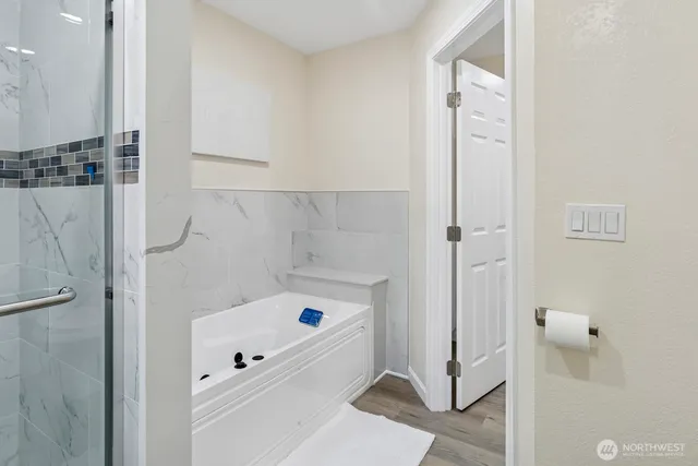a bathroom with a sink vanity granite and a mirror