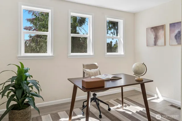 a view of a workspace with furniture