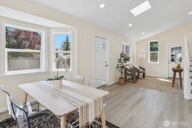 a view of a dining room with furniture window and wooden floor