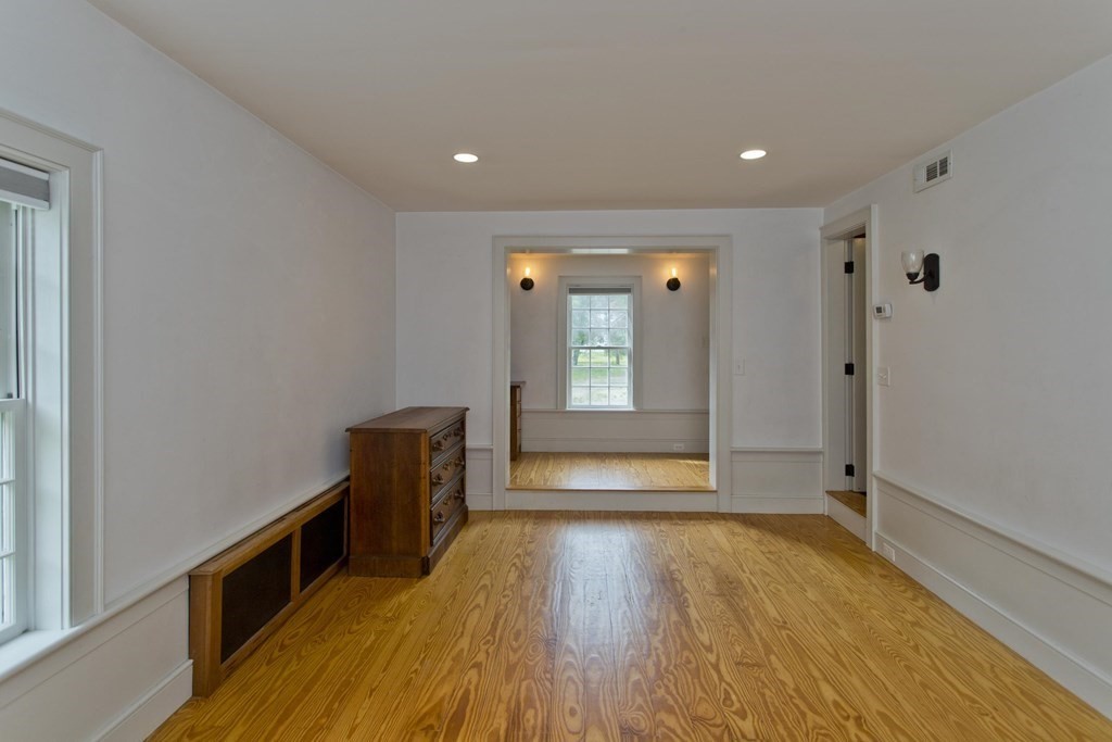 621 Amherst Road Sunderland, MA 01375 - Photo 36 of 42 wooden floor in an empty room with a window