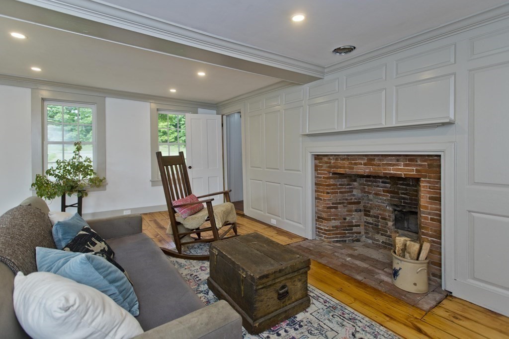 621 Amherst Road Sunderland, MA 01375 - Photo 7 of 42 a living room with furniture and a fireplace