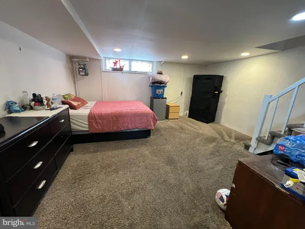 a bed room with a bed and a television