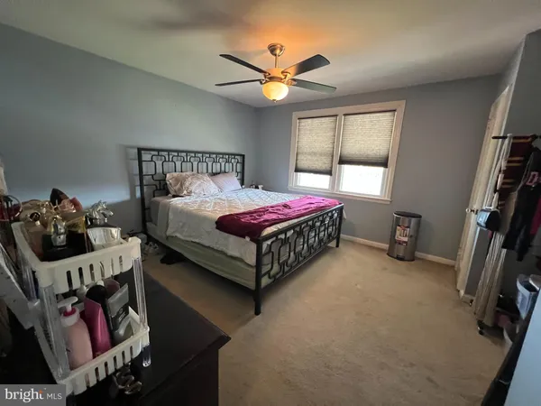 a bed room with a bed and a window