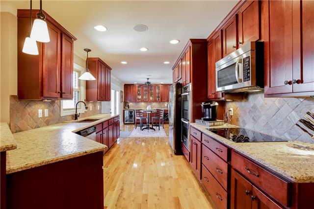 4305 Cedar Grove Road Murfreesboro, TN 37127 - Photo 2 of 20 This is the Kitchen of ALL Kitchens-- beautiful Shaker style cabinets w/pull-outs, double oven, hardwood floor, leather granite counters, Venetian Bronze fixtures, counter bar and stainless appliances - imagine cooking or entertaining here!