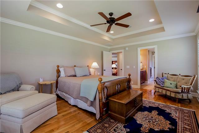 4305 Cedar Grove Road Murfreesboro, TN 37127 - Photo 13 of 20 Check out this great size Owner Suite with hardwood floor, tray ceiling and an adjoining separate custom-built room as an Owner Suite closet which is 13x11! Closets in the home all have wood shelving!