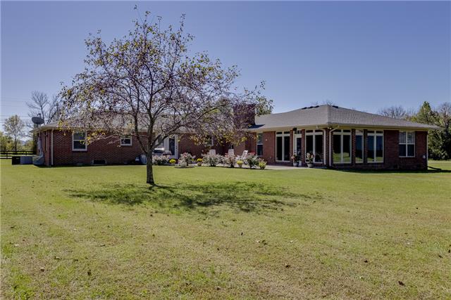 4305 Cedar Grove Road Murfreesboro, TN 37127 - Photo 5 of 20 Looking at the back of the L-shaped Ranch home filled with beautiful shrubs and flowers! Home has new electric, recessed lights, upgraded plumbing, roof replaced, and new windows throughout!