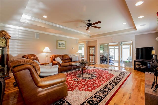 4305 Cedar Grove Road Murfreesboro, TN 37127 - Photo 7 of 20 The Great Room has tray ceiling, hardwood floor, beautiful copper slate wood-burning fireplace and surround sound!