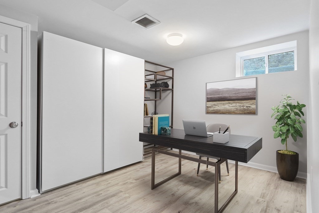 40 Whittier Road Newton, MA 02460 - Photo 16 of 20 a workspace with furniture and wooden floor