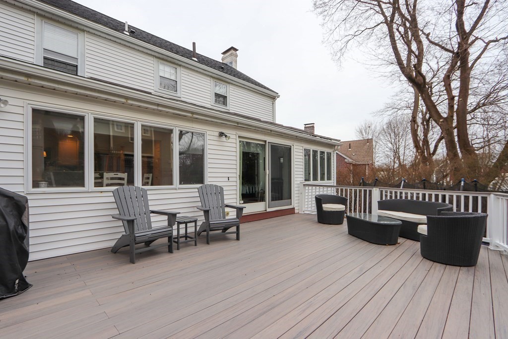 40 Whittier Road Newton, MA 02460 - Photo 17 of 20 a view of a house with sitting area and wooden bench