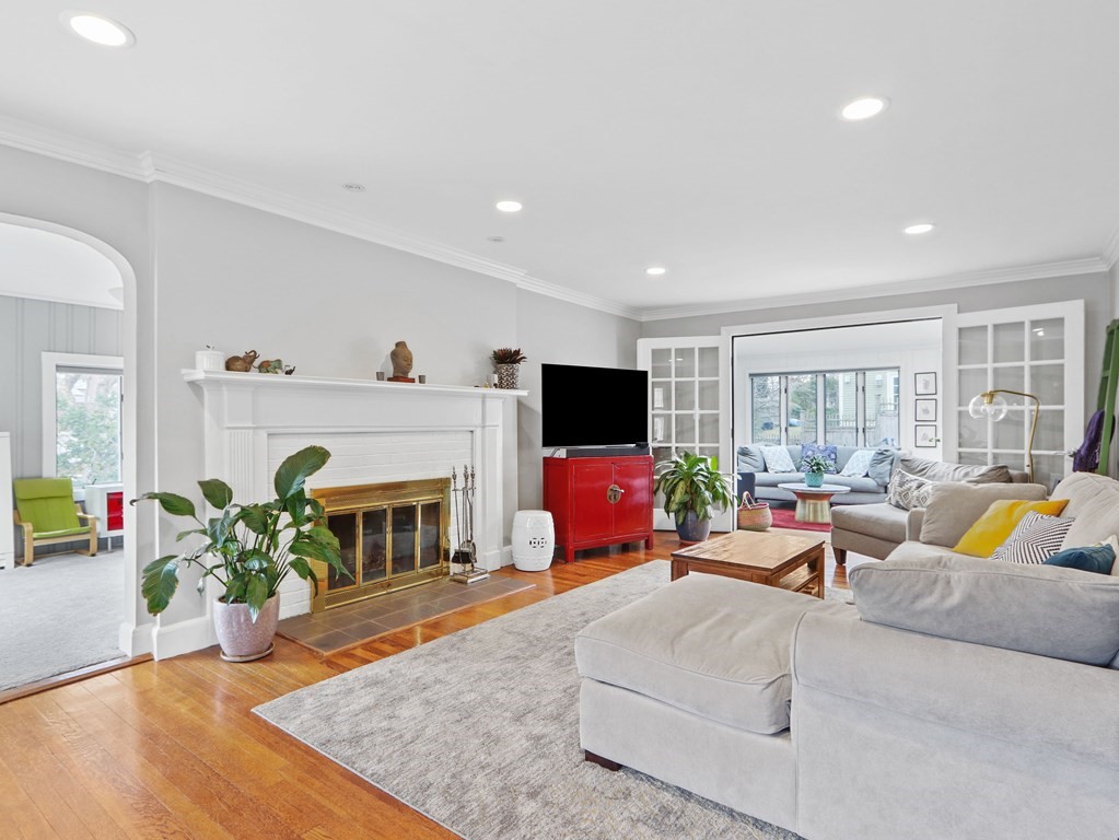 40 Whittier Road Newton, MA 02460 - Photo 3 of 20 a living room with furniture a flat screen tv and a fireplace